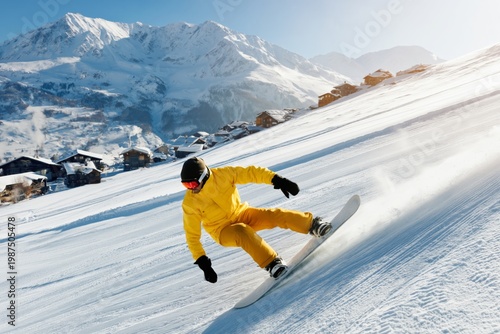 Snowboarder Rides Down Snowy Slope in Mountain Area During Sunny Day