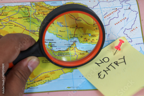 Bilde på lerret Magnifying glass over map, no entry sign, travel restrictions, border control co