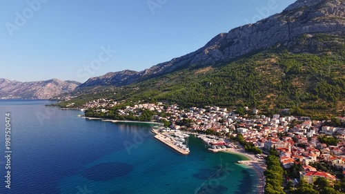 Aerial view of Baska Voda town on the Makarska Riviera in Croatia, beautiful coastal landscape with Biokovo mountain and Adriatic Sea