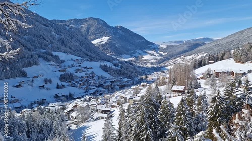 View from above of the town of Ortisei on a sunny winter day.