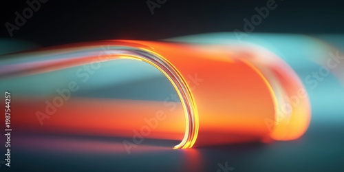 Abstract glowing orange and teal ribbon flowing through darkness with soft focus