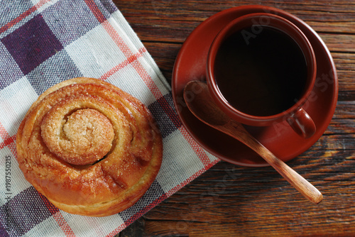 Fresh bun and coffee cup