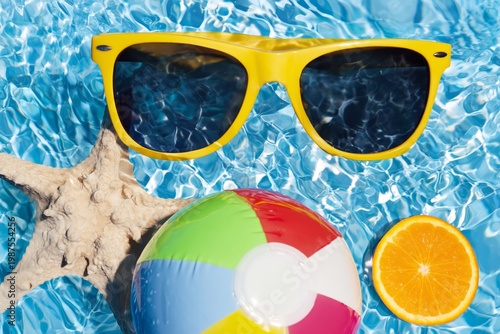 Summer Fun in the Swimming Pool With a Beach Ball and Orange Slice on a Sunny Day