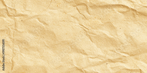 Crumpled brown paper texture background with wrinkles and creases for design and craft projects