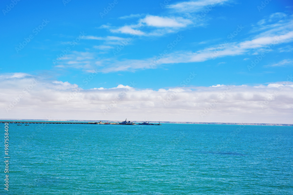 Fototapeta premium Dakhla beach with blue sky and clouds
