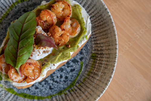 Wallpaper Mural Bruschetta with shrimp, cream cheese, avocado and poached egg. Top view, selective focus. Torontodigital.ca