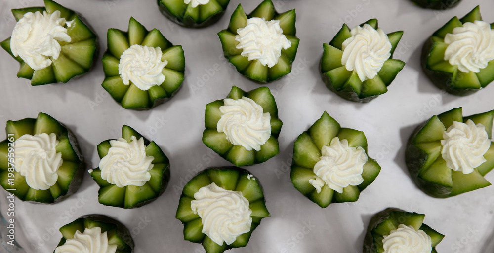 custom made wallpaper toronto digitalParty appetizer with cucumber and cream cheese. Serving snacks at a party. Selective focus. Top view.