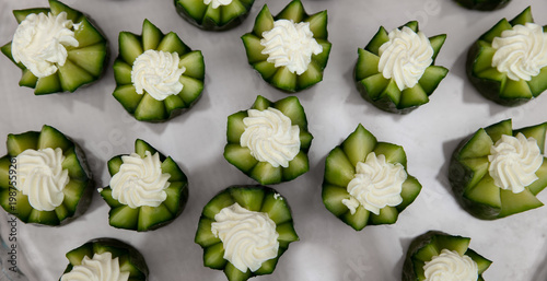 Wallpaper Mural Party appetizer with cucumber and cream cheese. Serving snacks at a party. Selective focus. Top view. Torontodigital.ca