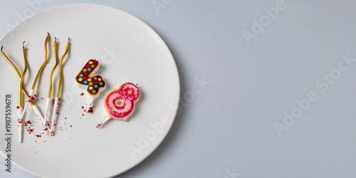 Golden candles in the shape of the number 48 on plate. Forty eight year birthday celebration banner. Selective focus, copy space