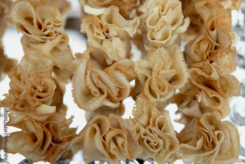 Party appetizer with pancakes and ham and cheese. Serving snacks at a party. Selective focus.