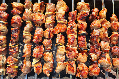 Grilled meat skewers on barbecue