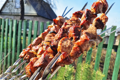 Grilled meat skewers on backyard