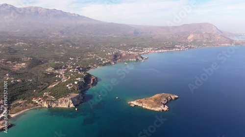 Aerial drone shot.View of famous beach in the summer, Crete, Greece. Famous beach with river and palm trees in Libyan sea. Tropical island, Panoramic view, Most beautiful beaches of Crete island