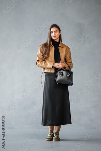 Wallpaper Mural Caucasian Woman Urban Commuter Styling Leather Crossbody Bag, Threequarter Profile With Neutral Backdrop, Torontodigital.ca