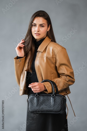 Wallpaper Mural Caucasian Woman Fashion Blogger Looking Sideways While Holding Woven Handbag, Evocative Profile With Soft Torontodigital.ca