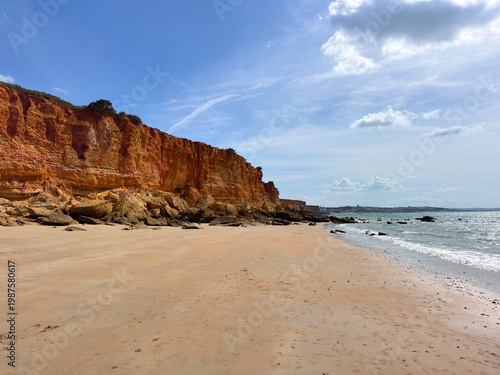 Cala del Aceite, beach and red cliffs near Conil de la Frontera and Cabo Roche at the Atlantic Ocean in summer, Punta del Sudario, Cadiz, Costa de la Luz, Andalusia, Spain	