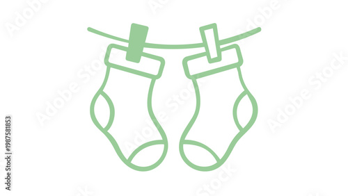 Minimalist green line art vector illustration of a par of cute baby socks hangig on a clothesline with clthespins, flat design iconfor newborn clothing, launry, and nursery essentials
