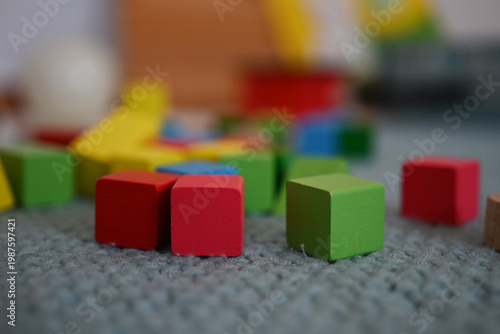 A close-up capture of several colored wooden toy blocks