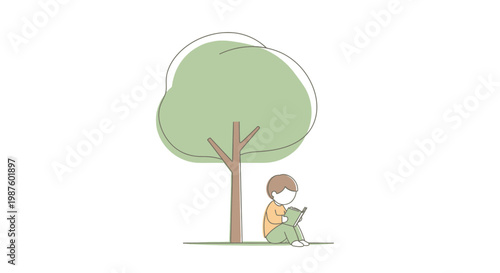 Child sitting under a tree reading.