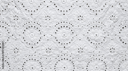 Photos White cotton fabric with floral eyelet embroidery texture