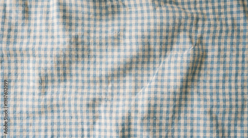Fotografie Wrinkled blue and white gingham checkered cotton fabric texture