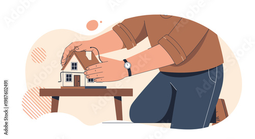 Hands building a miniature house model on a table, concept of home construction and real estate