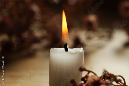 burning candle on a dark background. Candle. Light. Decoration. Photo. Celebration. 