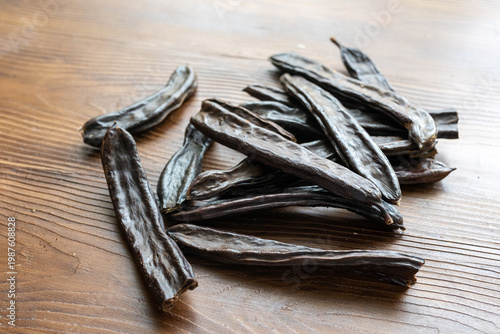 Close-up of Dried Carob Pods on Table