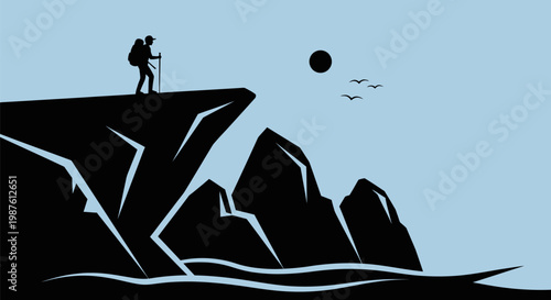 Man standing on mountain peak edge.