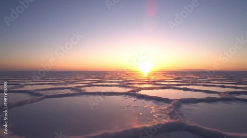 Skyline Illuminated By Morning Glow. Serene Scene Capturing Golden Light Reflecting On Soft Cloud Layers. Calm Drone Perspective Showcasing Sunrise With Colorful Mist And Cloud Reflections