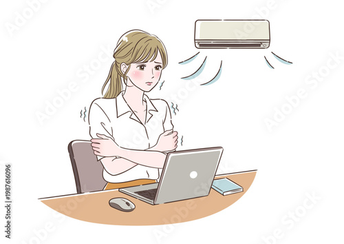 冷房で寒い中デスクワークをする女性　右向き