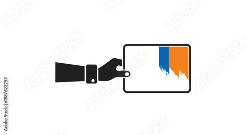 Hand holding color swatch palette.