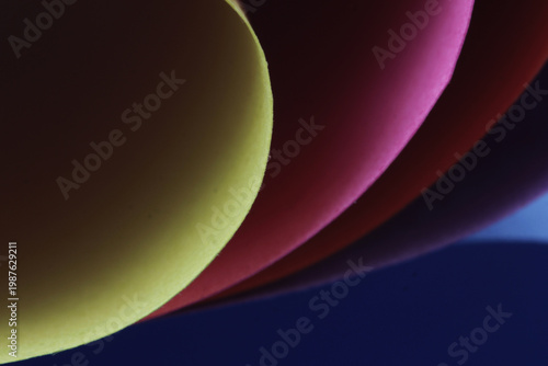 Beautiful abstract background in the form of lines and curves from colorful paper