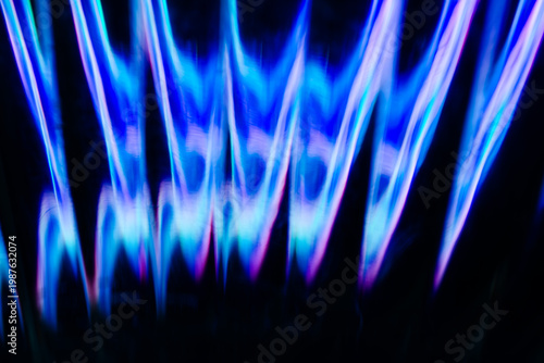Deep blue and purple vertical flame like light structures