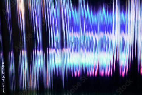 Vertical blurred glass texture with vibrant blue and pink neon light distortion