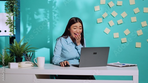 Bild auf Leinwand Happy cheerful employee burst out laughing watching laptop screen at work