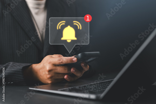 Mobile notification alert concept with man holding smartphone and glowing bell icon, representing real-time alerts, reminders, digital communication, and user engagement.