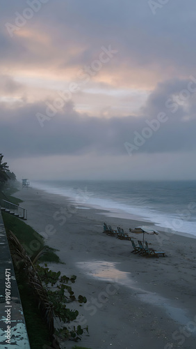 Gloomy Beach Scene With Stormy Sky and Ocean Waves On Sand With Wet Patches