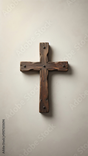 Rustic Wooden Cross Mounted On A Textured Light Colored Wall With Dramatic Lighting