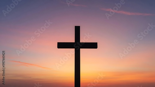 Black Cross Silhouette Against A Vibrant Orange Purple Sunset Sky With Wispy Clouds