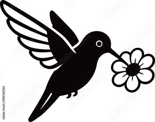 Silhouette of a hummingbird feeding from a flower