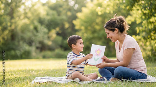 Mother's Day outdoor moment with son presenting handmade artwork to mom showing creativity love for lifestyle magazine editorial photography