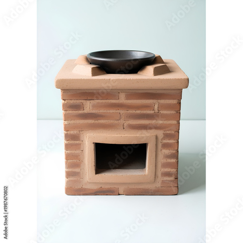 Rustic brick oven with a black bowl on top ready for cooking.