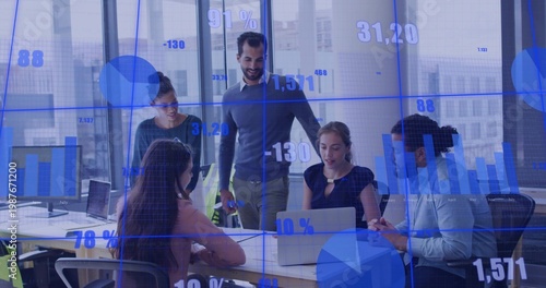 Leading manager guiding five team members at office table in business casual, showing laptop charts