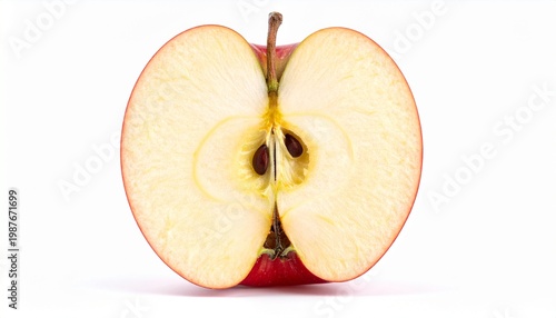 A halved red apple reveals its seeds and flesh on a plain surface
