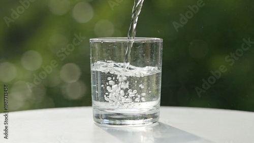 Fresh Drinking Water Pouring Into Clear Glass With Bubbles Natural Light Clean Healthy Hydration Concept Close Up