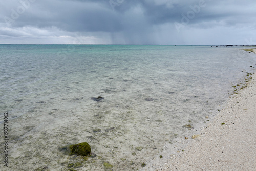 Tableau sur toile Approaching tropical squall over the turquoise ocean in Ishigaki Island