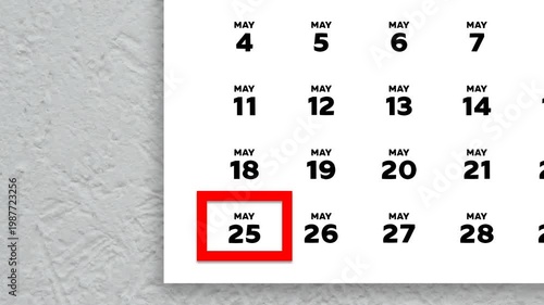 The date May 25th marked with a red cursor on the wall calendar 2026