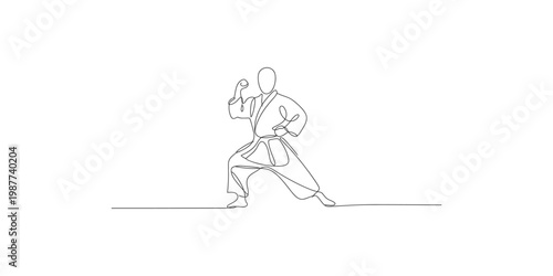 Continuous line drawing of a karate practitioner in a fighting stance isolated on white background