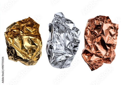 Three crumpled metallic foils, gold, silver, and copper, isolated on white